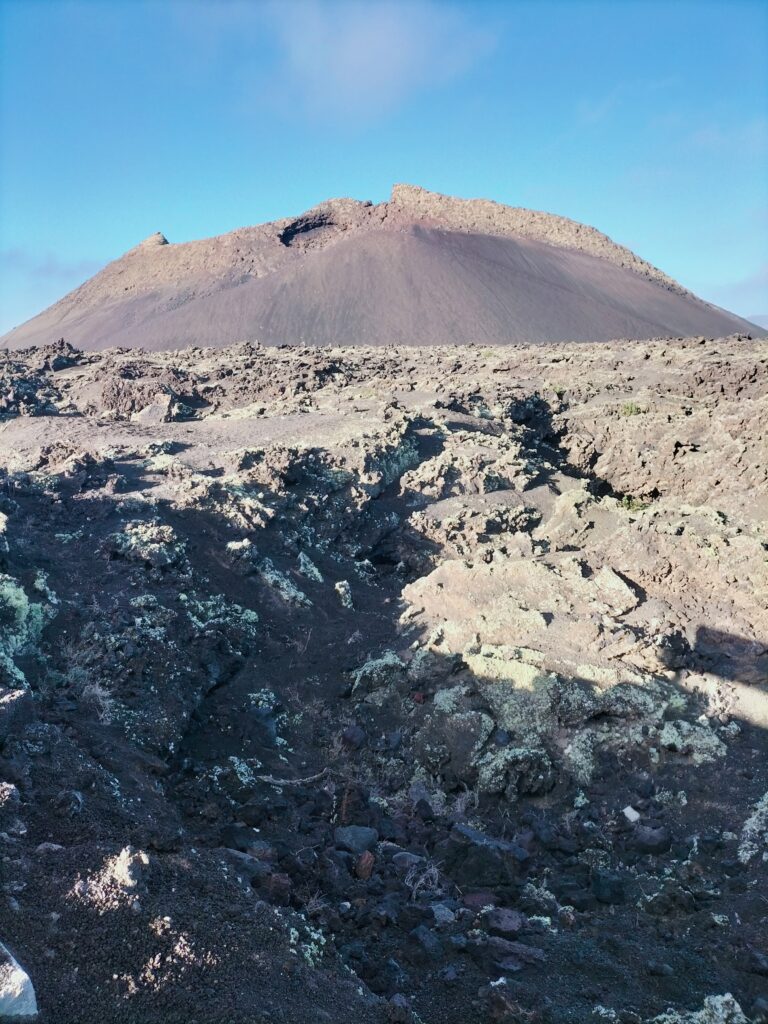 The volcano rising from the solidified lava.