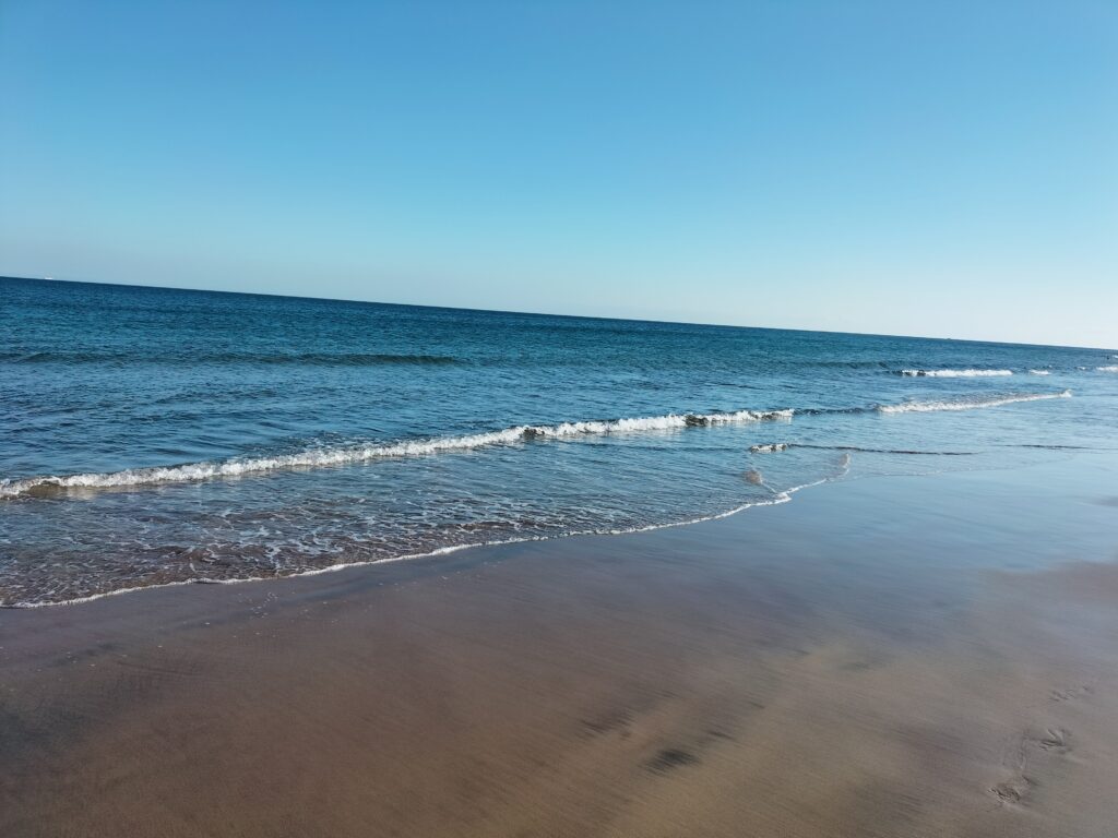 Photo of the beautiful Playa Blanca beach with sand and sea.