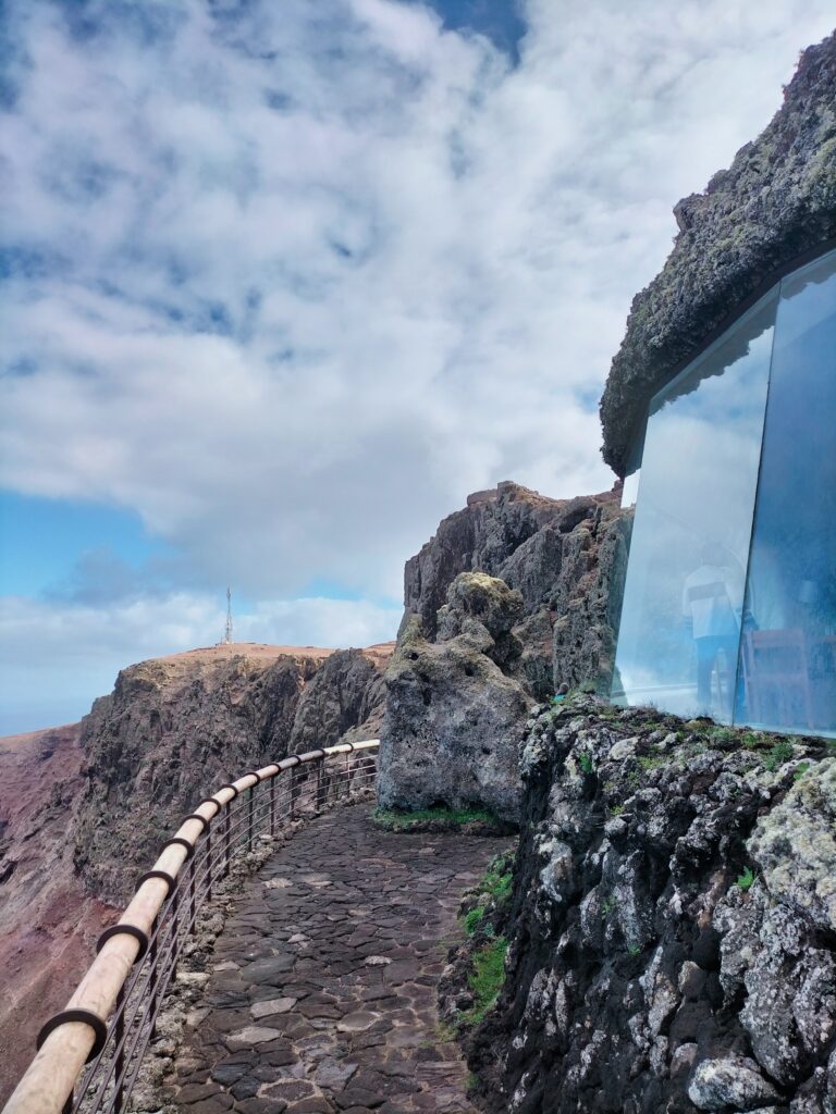 The large window of the Mirador del Rio from which you can see the ocean and the other islands of the archipelago.