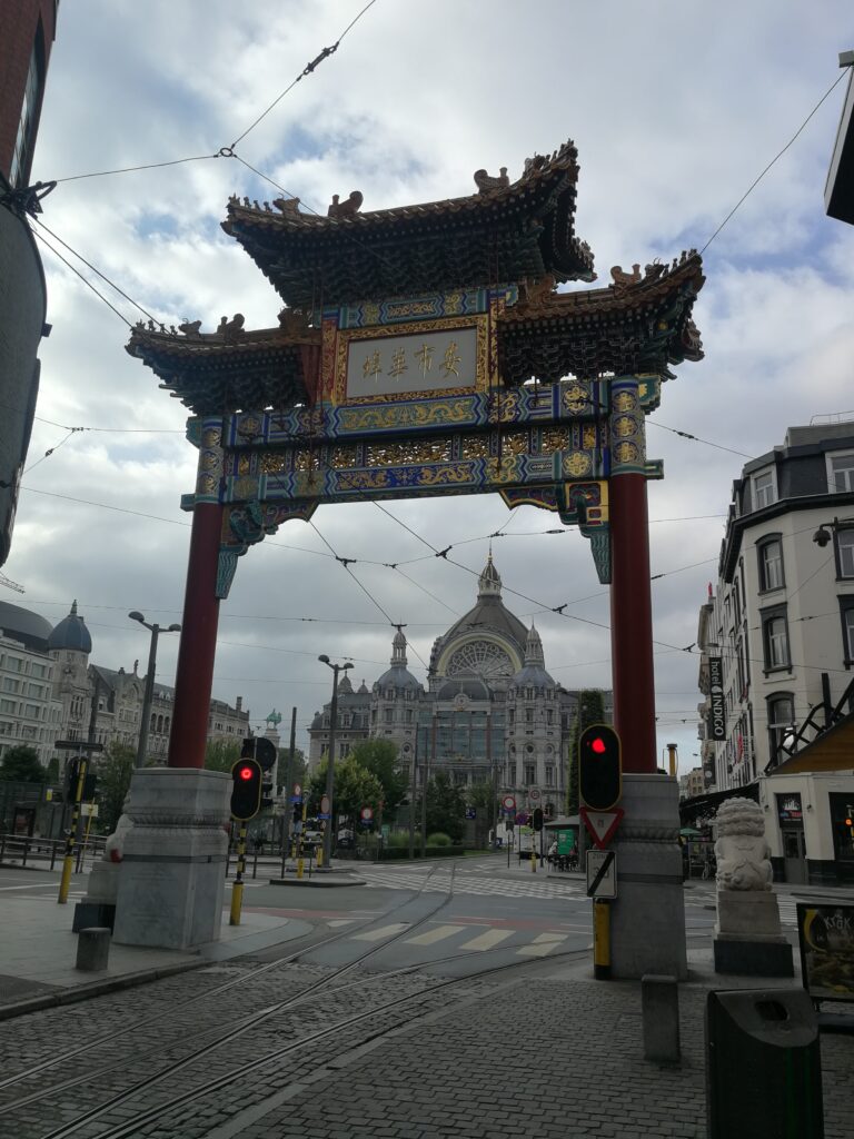 The entrance of China Town in Antwerp. On the backgroung the Central Station.