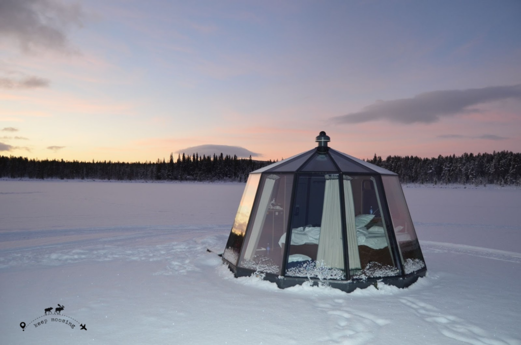 Our glass igloo-like hotel sits on a frozen river outside Kiruna.