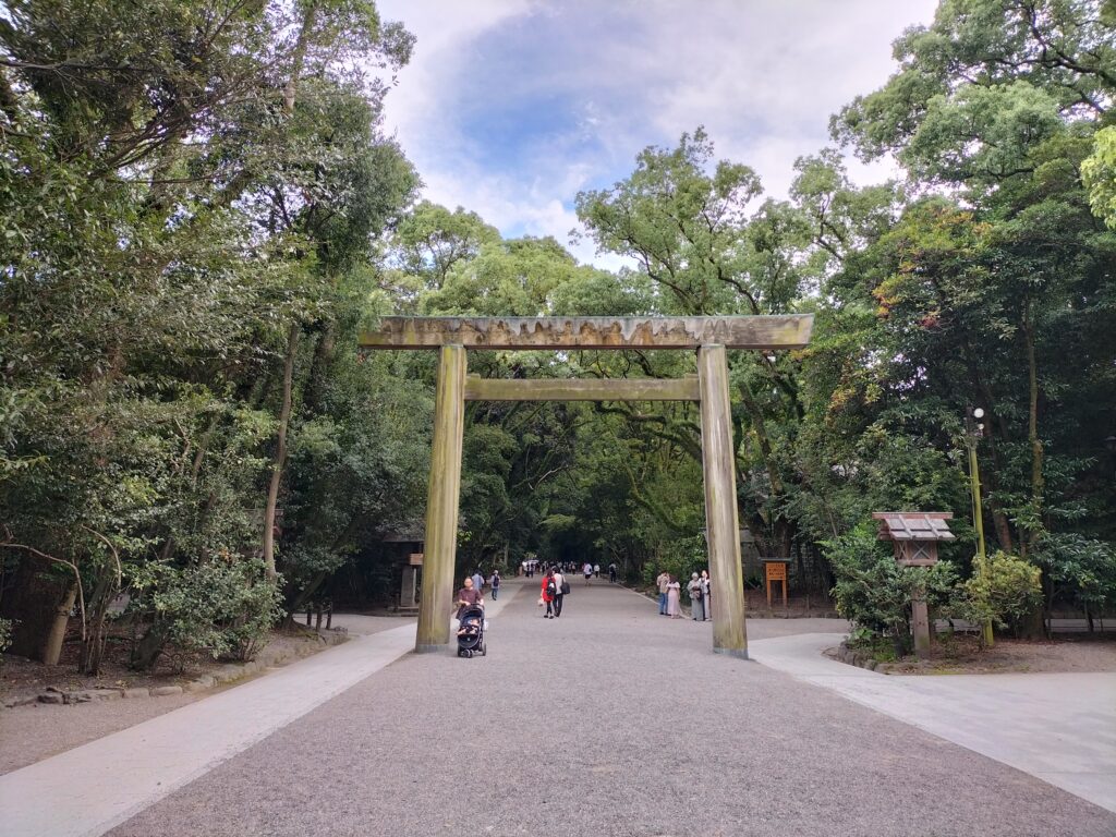 The entrance Torii of Atsuta Jingu Temple among the trees.