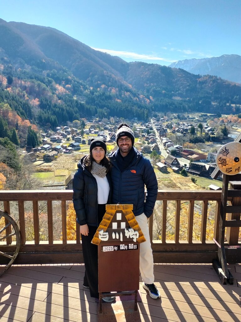 Tiziano and Claudia in the foreground, in the background the village of Shirakawa-go seen from above.