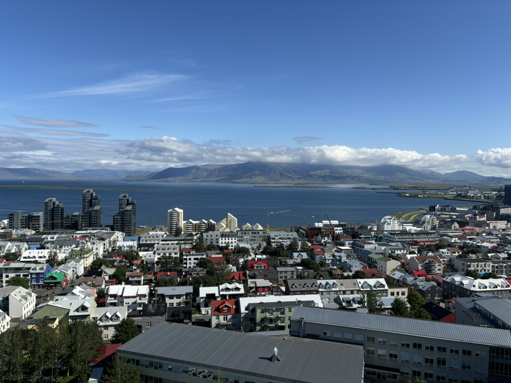 Panoramic view from the bell tower with the sea, houses and mountains in the background!