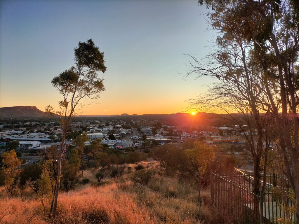 Sunset at Anzac Hill and view of the MacDonnell Ranges.