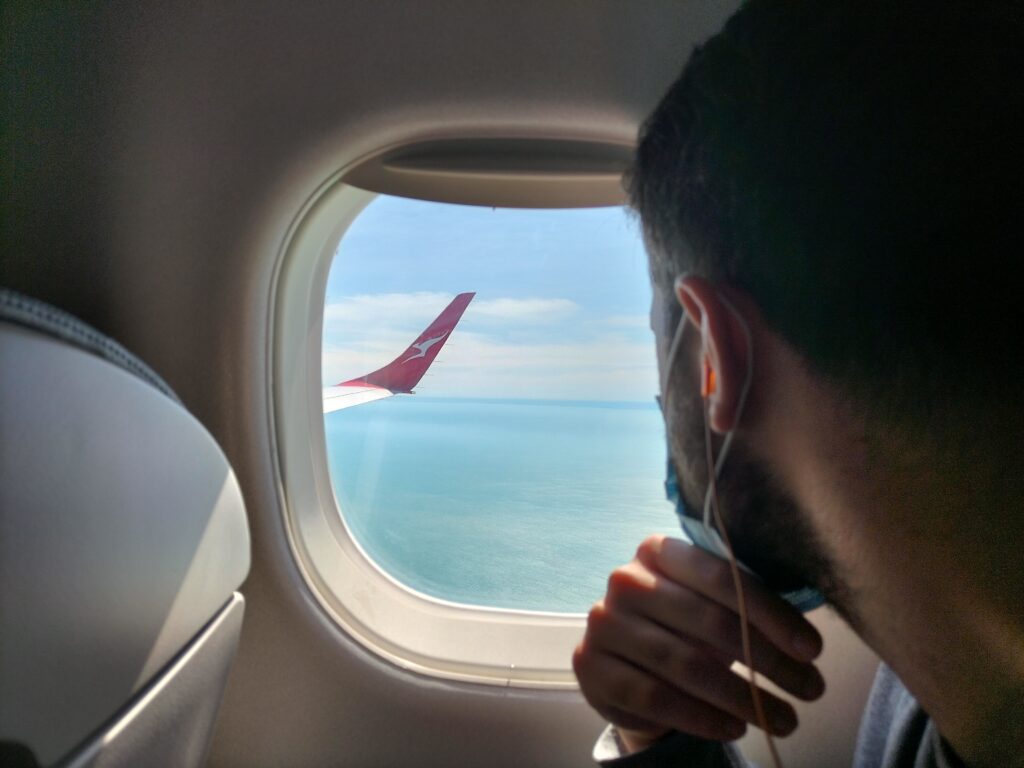 Tiziano looking out of the window of the plane going to Darwin. What to see in Darwin in 2 Days