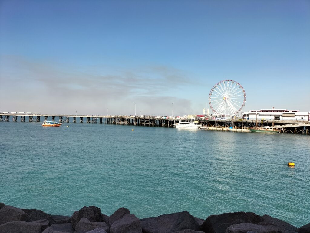 Image of the Waterfront Precinct with a big wheel and some boats.