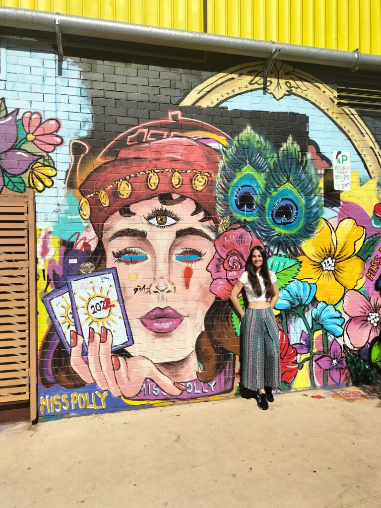 Claudia with a mural art work.