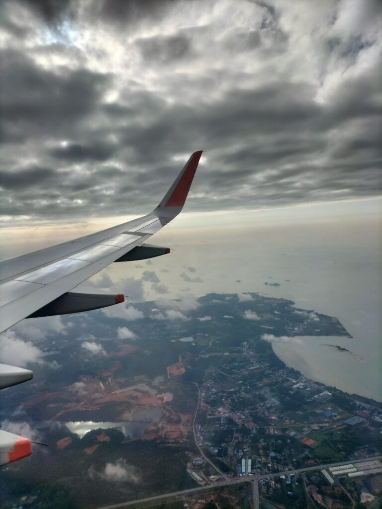 The wing of our plane landing in Singapore.