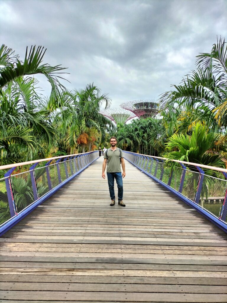 Tiziano in the centre of the image on a wooden bridge and the gardens on both sides.