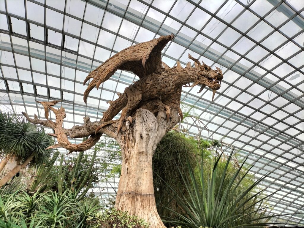 Big wooden sculpture of a dragon inside the Cloud Forest