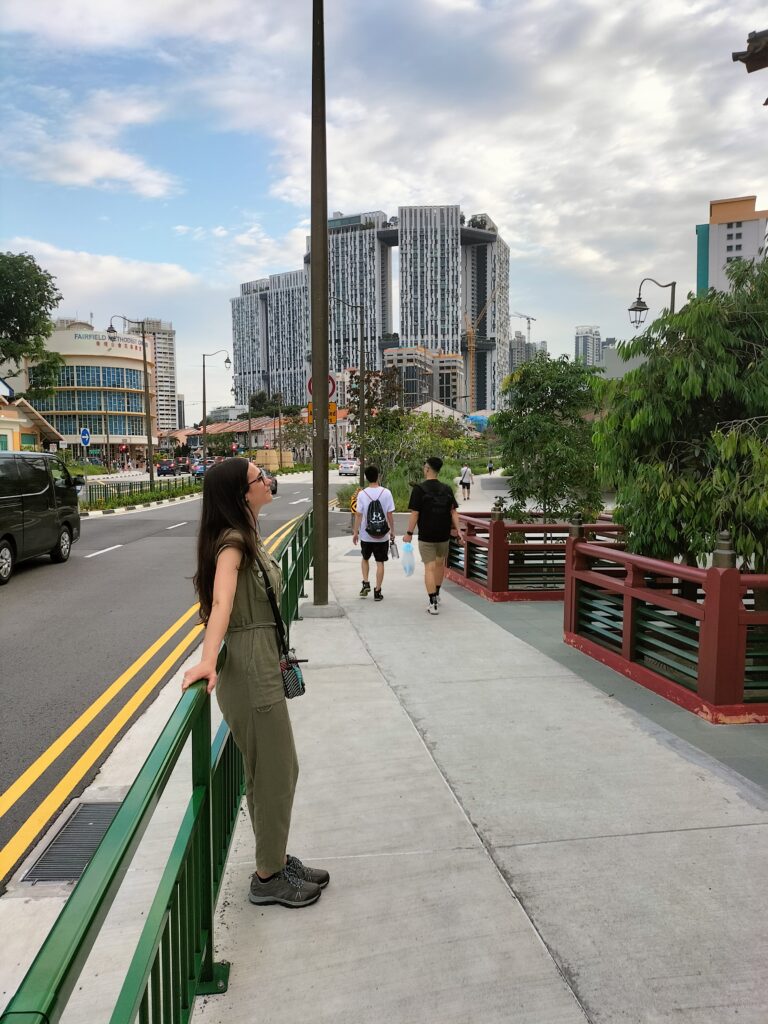 Claudia in China Town with 2 other guys in the street.