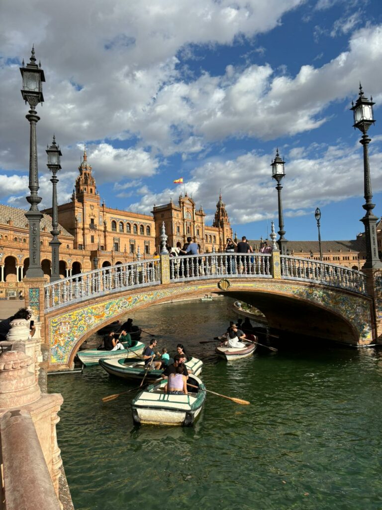 View of boats under a bridge in Plaza de Espana.