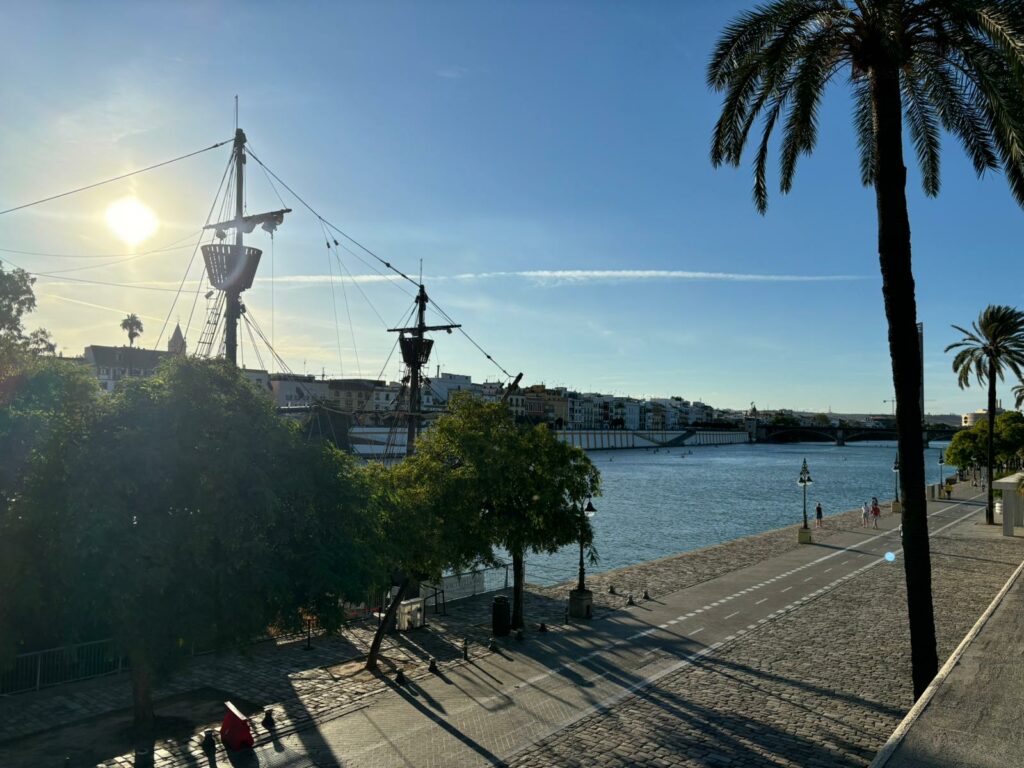 View of the Guadalquivir River with the Triana neighborhood in the background.