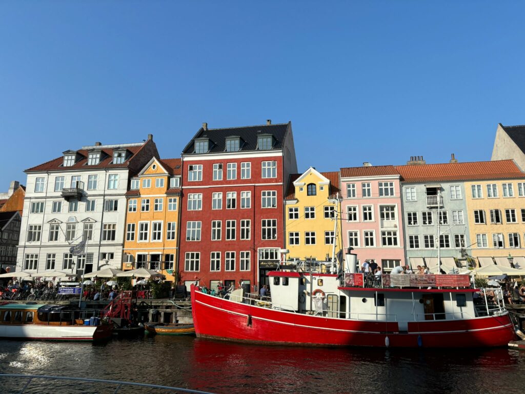 Beautiful area of Nyhavn with colorfull houses and boats.