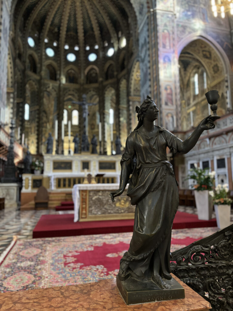 Statue with the altar behind.