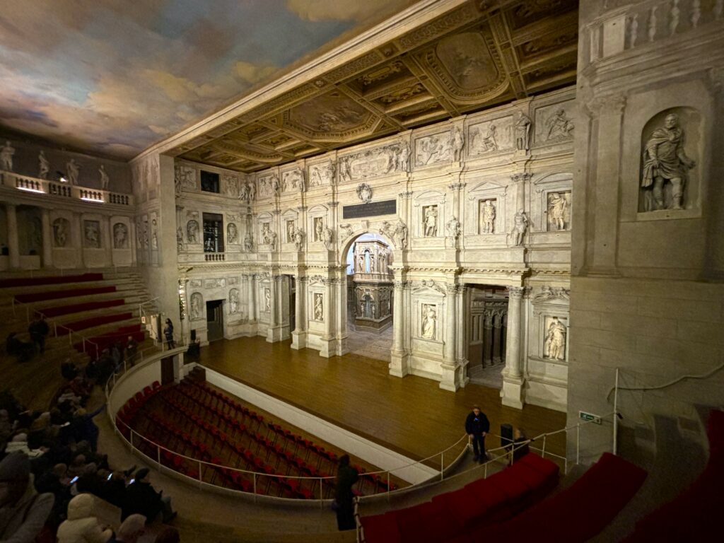 The inside of Teatro Olimpico with people and the stage set. What to See in Vicenza in 1 Day