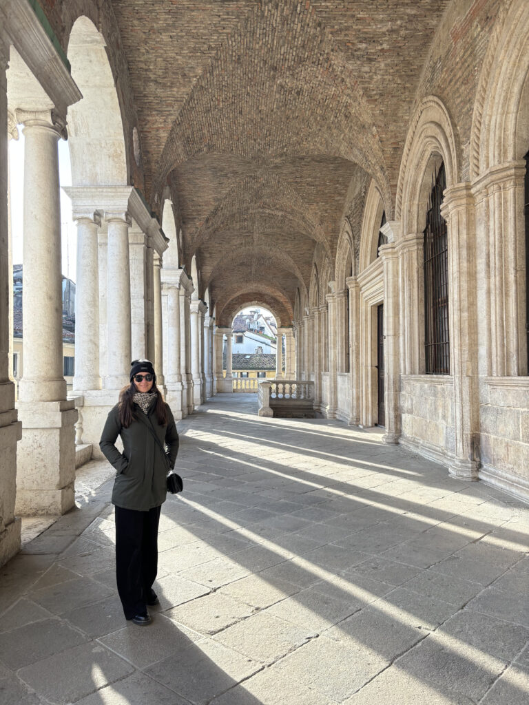 Claudia standing in Loggia del Capitanio by Palladio.