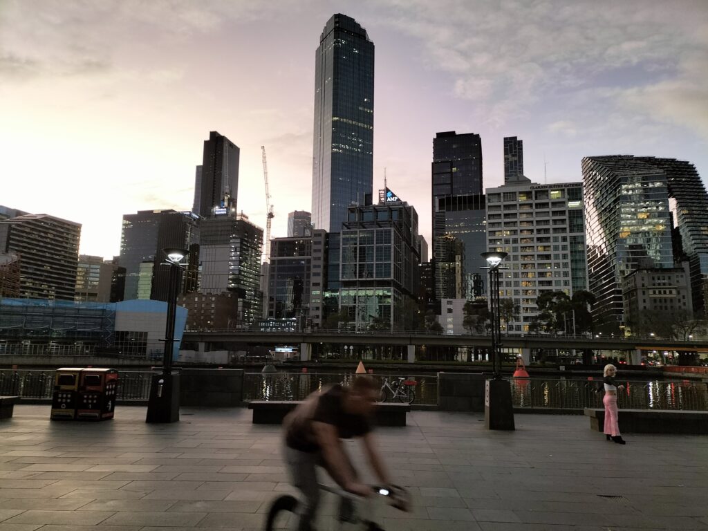 View from the Southbank Promenade with a man on a bike in the foreground.