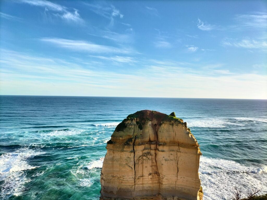 A big rock in the water.