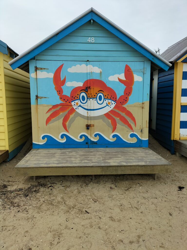 A hut with a crab painted.