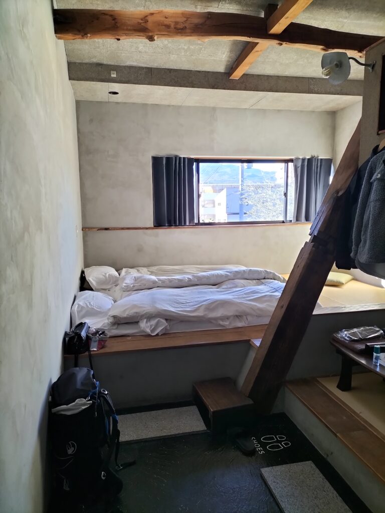 Room inside the hostel with beds on the futon.