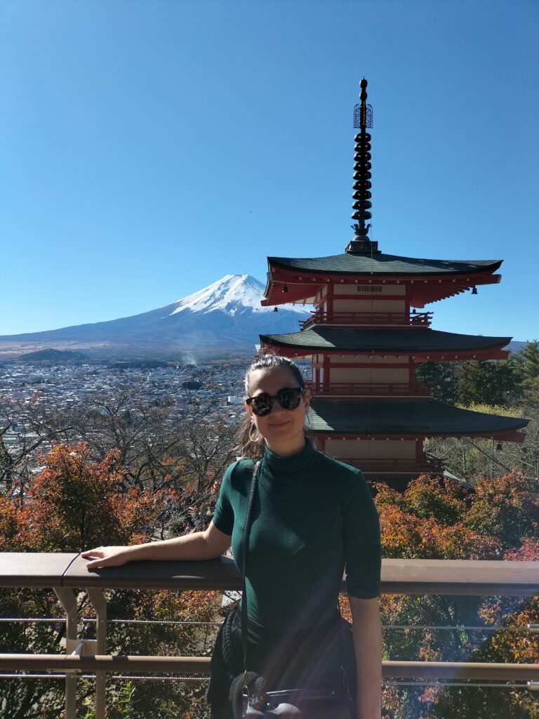 Claudia with behind a pagoda and Mt. Fuji.